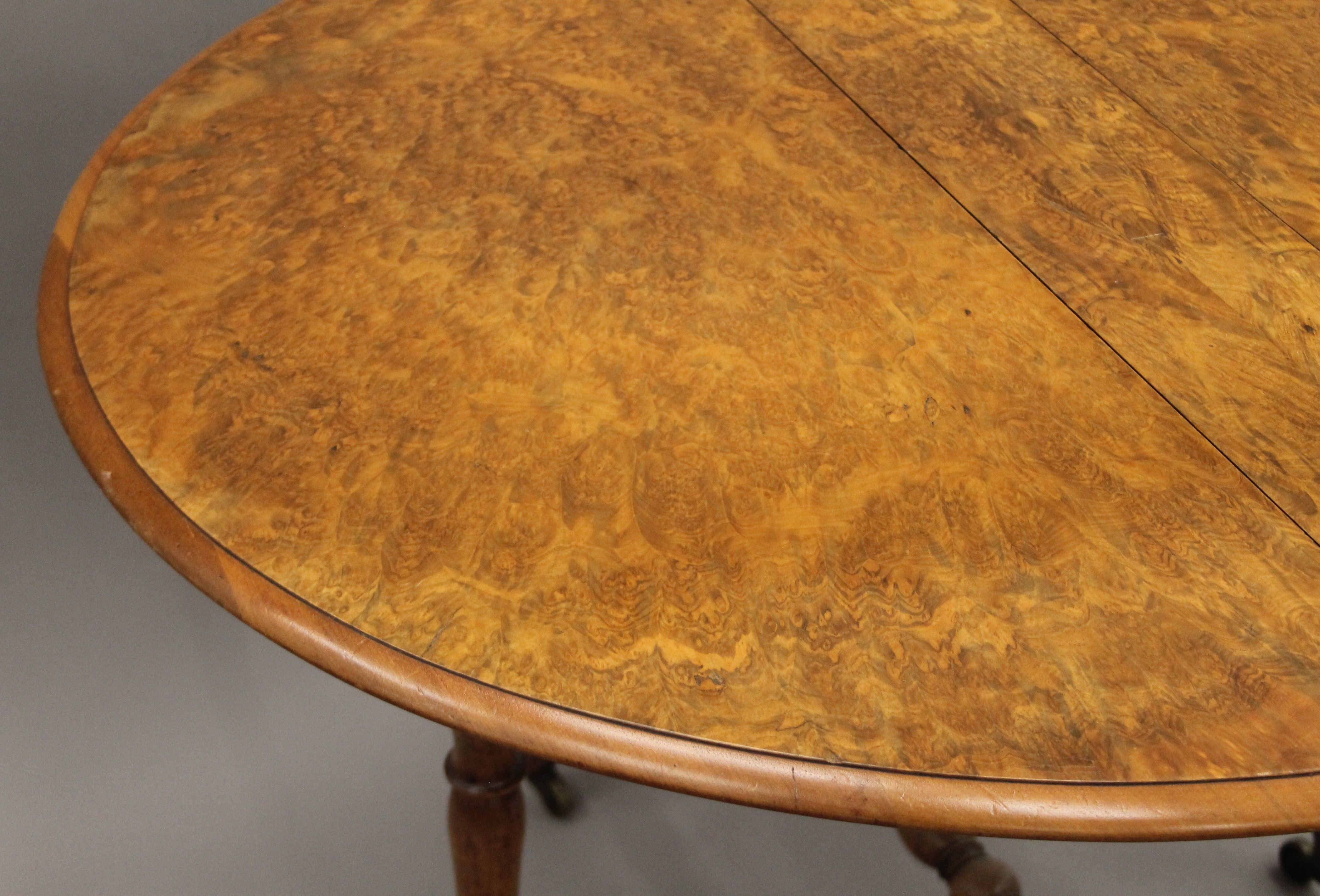 A Victorian burr walnut Sutherland table. 17 cm wide with flaps down. - Image 4 of 6