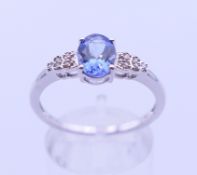 A 10 K white gold tanzanite ring. Ring size U.