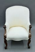 A Victorian upholstered spoon back armchair. 66 cm wide.