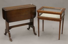 A modern vitrine and a modern gate leg table. The former 46 cm wide.
