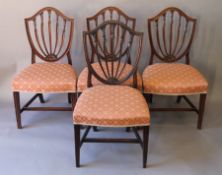 A set of four 19th century mahogany shield back chairs. 52 cm wide.