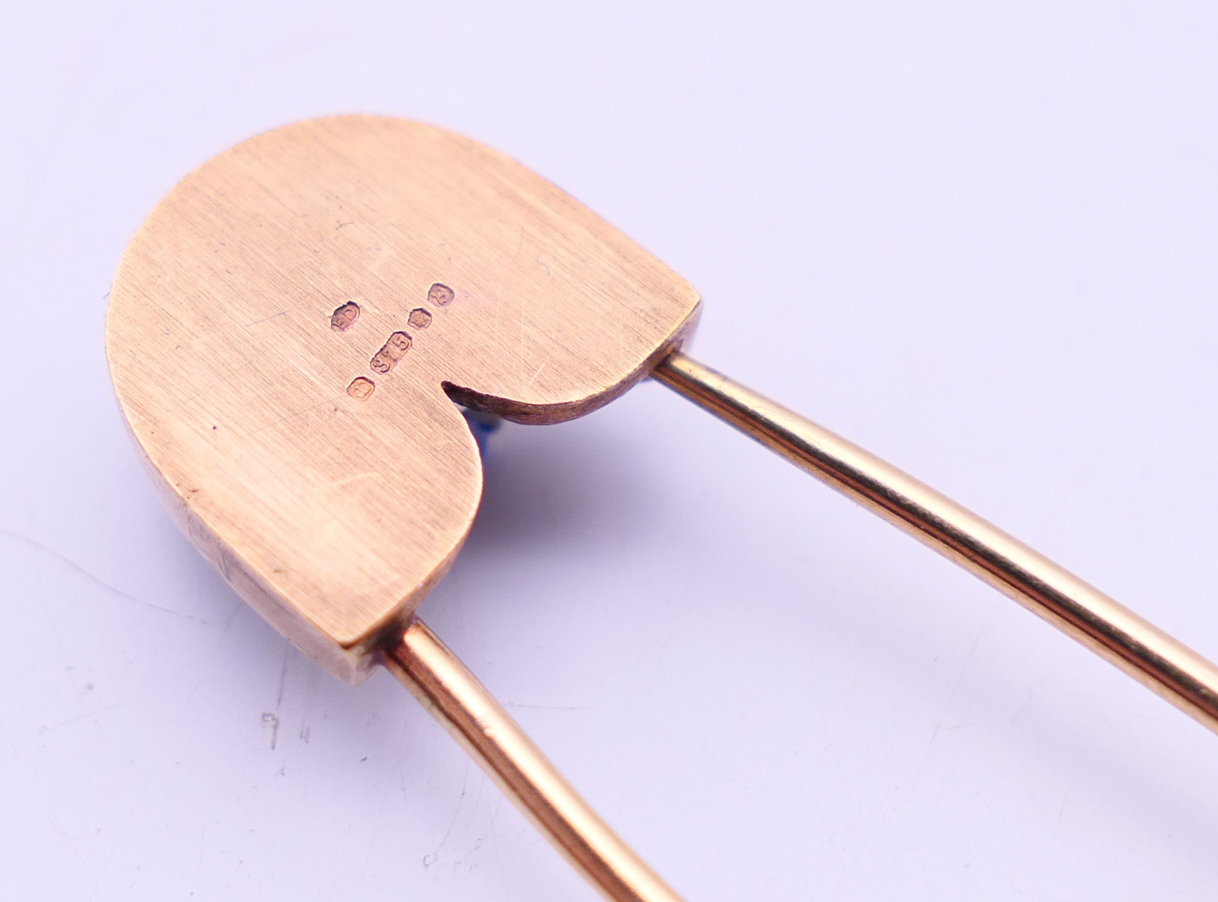 A 9 ct gold stone set safety pin form brooch. 6 cm high. 4.8 grammes total weight. - Image 6 of 6