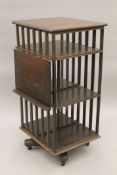 A Victorian oak revolving bookcase. 108 cm high.