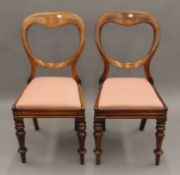 A pair of Victorian mahogany balloon-back chairs. 42 cm wide.