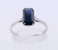 An 18 ct white gold and sapphire ring. Ring size P.