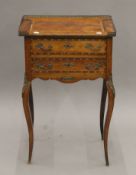 A 19th century French two-drawer side table. 49 cm wide.