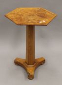A 19th century burr elm hexagonal tilt-top tripod table. 59 cm wide.