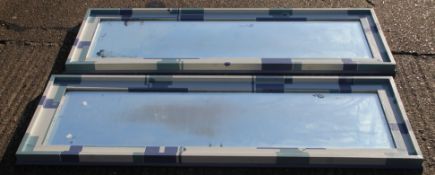 A pair of mirrors with contemporary painted frames. 66 x 174.5 cm overall.