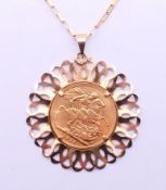 A 1911 sovereign pendant on a 9 ct gold chain. Pendant 4 cm diameter, chain 60 cm long.