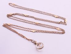 A 9 ct gold belcher chain and pendant. Chain 154 cm long, pendant 2.5 cm high.