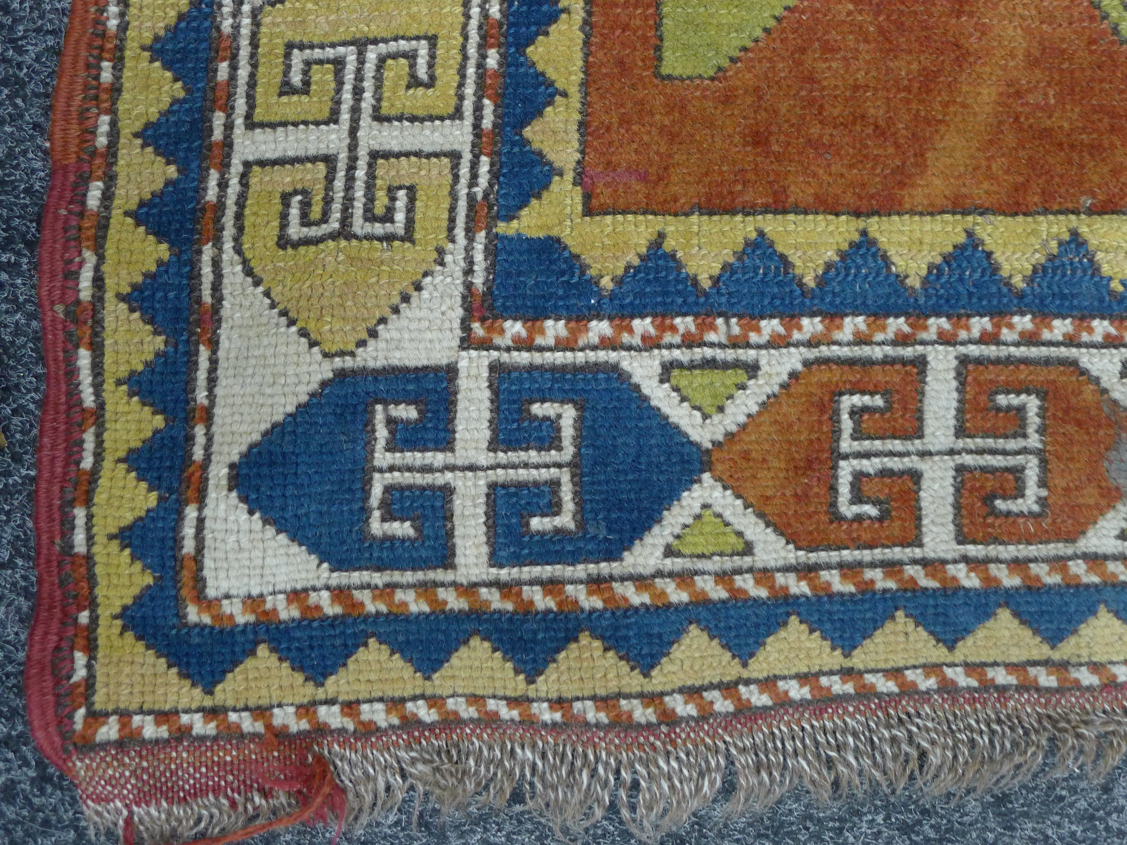 An Eastern red ground rug. 95 x 140 cm. - Image 2 of 6