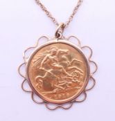 A 1913 half sovereign pendant on a 9 ct gold chain. Pendant 2.5 cm diameter, chain 60 cm long. 7.