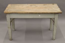 A Victorian pine kitchen table. 121 cm long.