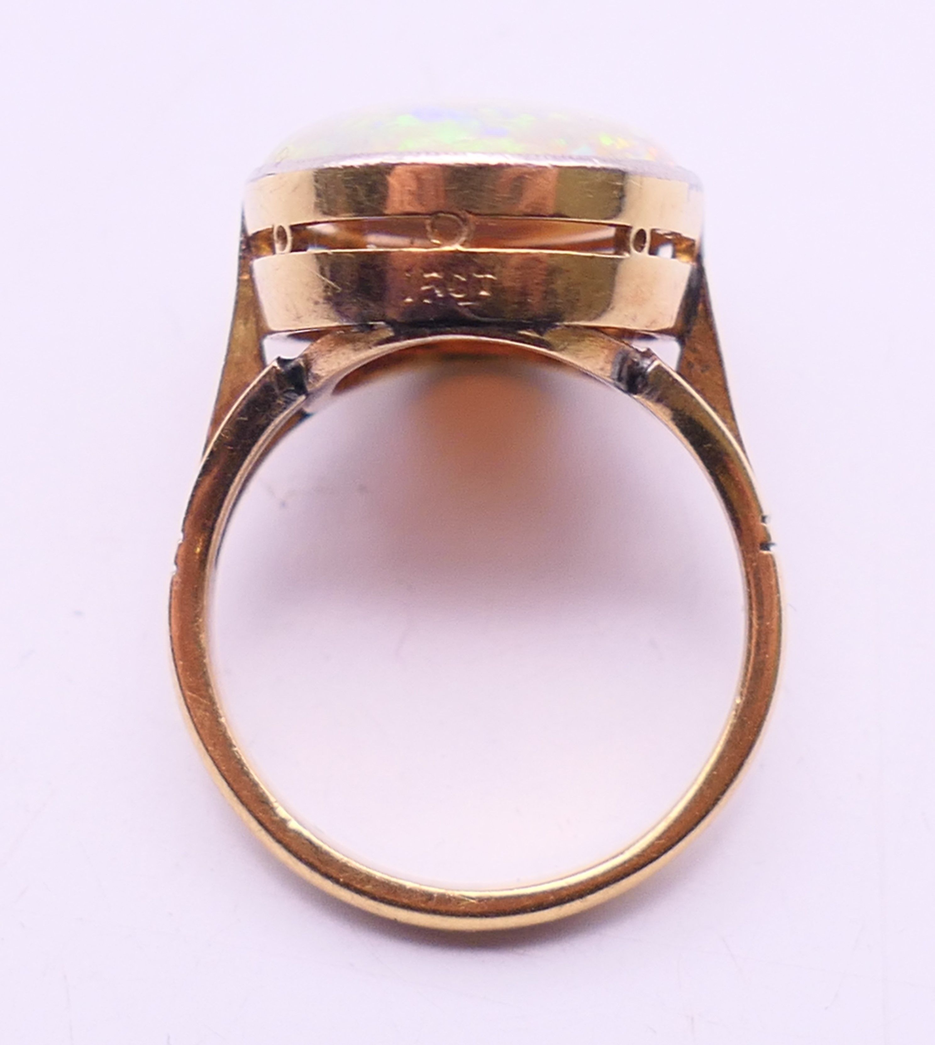 A 15 ct gold and opal ring. Opal 1.8 cm high. Ring size O. - Image 6 of 6