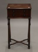 A Victorian mahogany two-drawer side table. 38 cm wide.