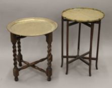 An early 20th century Chinese brass-topped folding table and another Eastern example. The former 34.