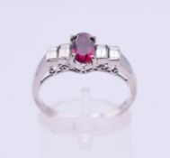 A 14 K white gold, ruby and diamond ring,