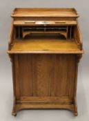 An early 20th century tambour-topped Lebus desk. 72 cm wide.