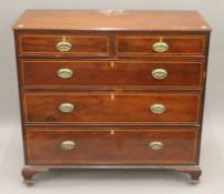 A 19th century inlaid mahogany chest of drawers. 123.5 cm wide.