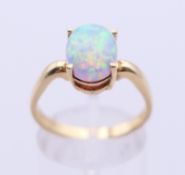 A 14 ct gold and opal ring. Ring size Q.