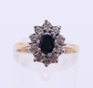A 9 ct gold, diamond and sapphire ring. Ring size M/N.
