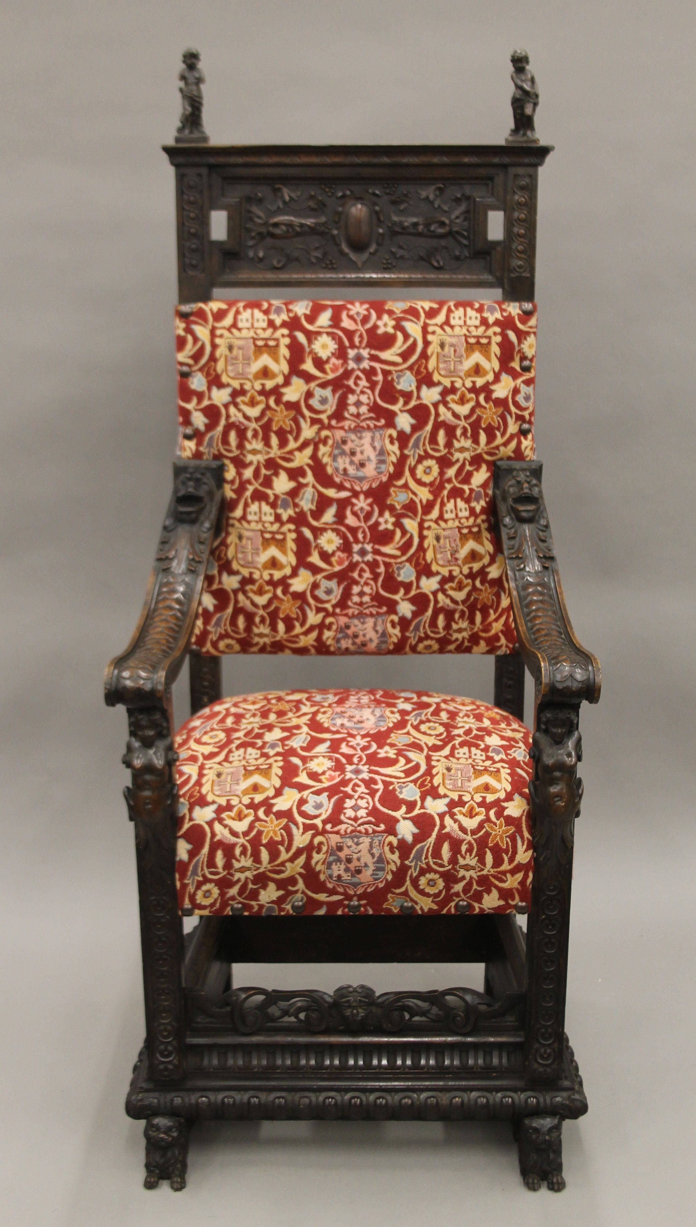 A 19th century carved walnut open armchair. 66 cm wide.
