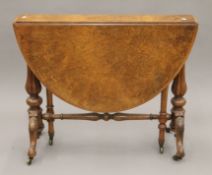 A Victorian burr walnut Sutherland table. 17 cm wide with flaps down.