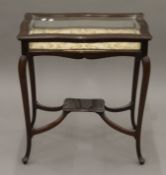 An Edwardian mahogany vitrine. 60 cm wide.