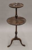 An early 20th century mahogany two-tier side table. 83 cm high.