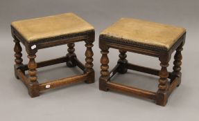 A pair of early 20th century leather-topped oak stools. 41 cm long.