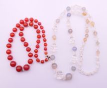Two bead necklaces. Grey and clear bead necklace 60 cm long, other necklace 40 cm long.
