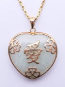 A 9 ct gold and jade heart form pendant, on a 9 ct gold chain. Pendant 2.