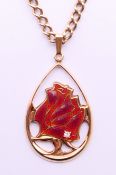 A 9 ct gold enamel and diamond 'Year of the Rose RNRS 1976' teardrop pendant on a 9 ct gold chain.