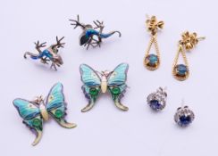 Four pairs of earrings, including a pair of silver and enamel butterfly earrings,