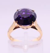 An 18 K gold and amethyst ring. 4.1 grammes total weight. Ring size K.