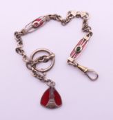 A silver watch chain and fob. 23 cm long.