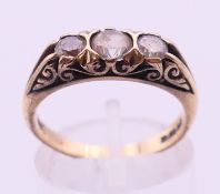 A 9 ct gold three-stone ring. 3.7 grammes total weight. Ring size M/N.