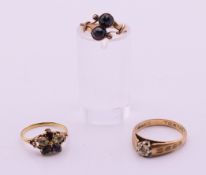 Three 9ct gold rings (two unmarked). 5.9 grammes total weight.