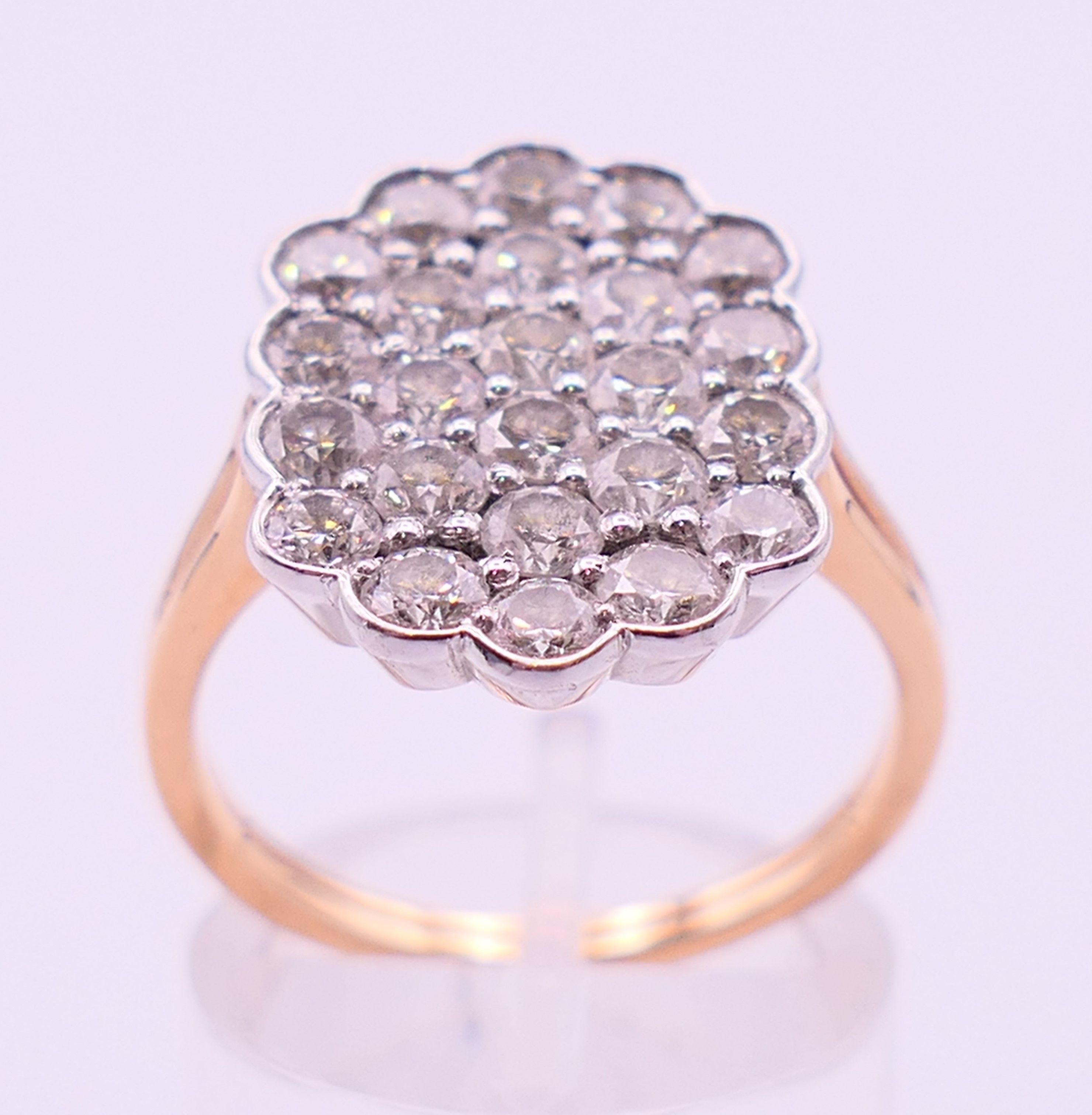 An unmarked gold diamond cluster ring. Ring size Q/R. - Image 2 of 5