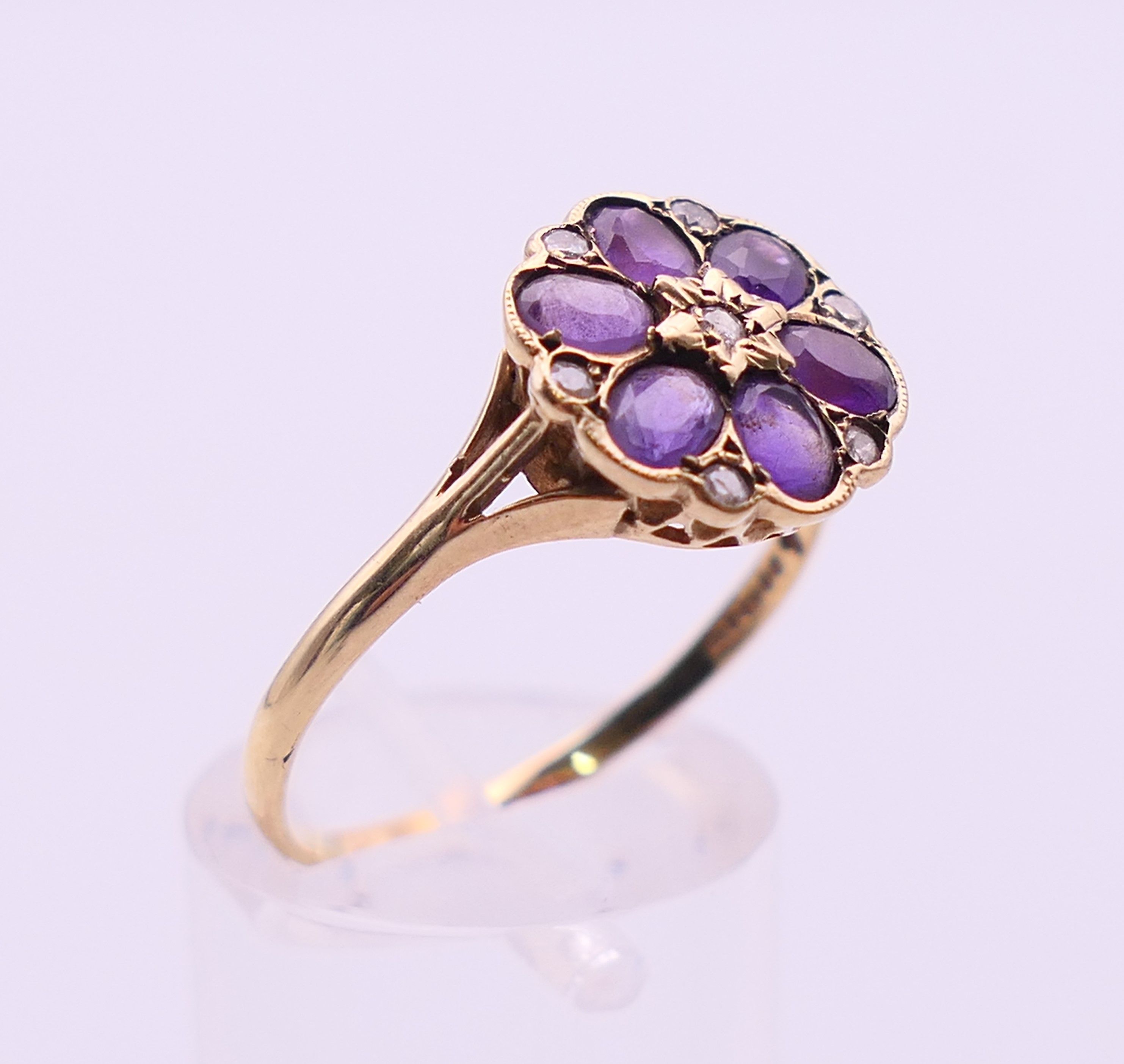 A 9 ct gold, amethyst and diamond cluster ring. Ring size U. - Image 3 of 5