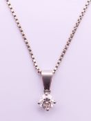 A diamond pendant on an 18 ct white gold chain. Pendant 0.