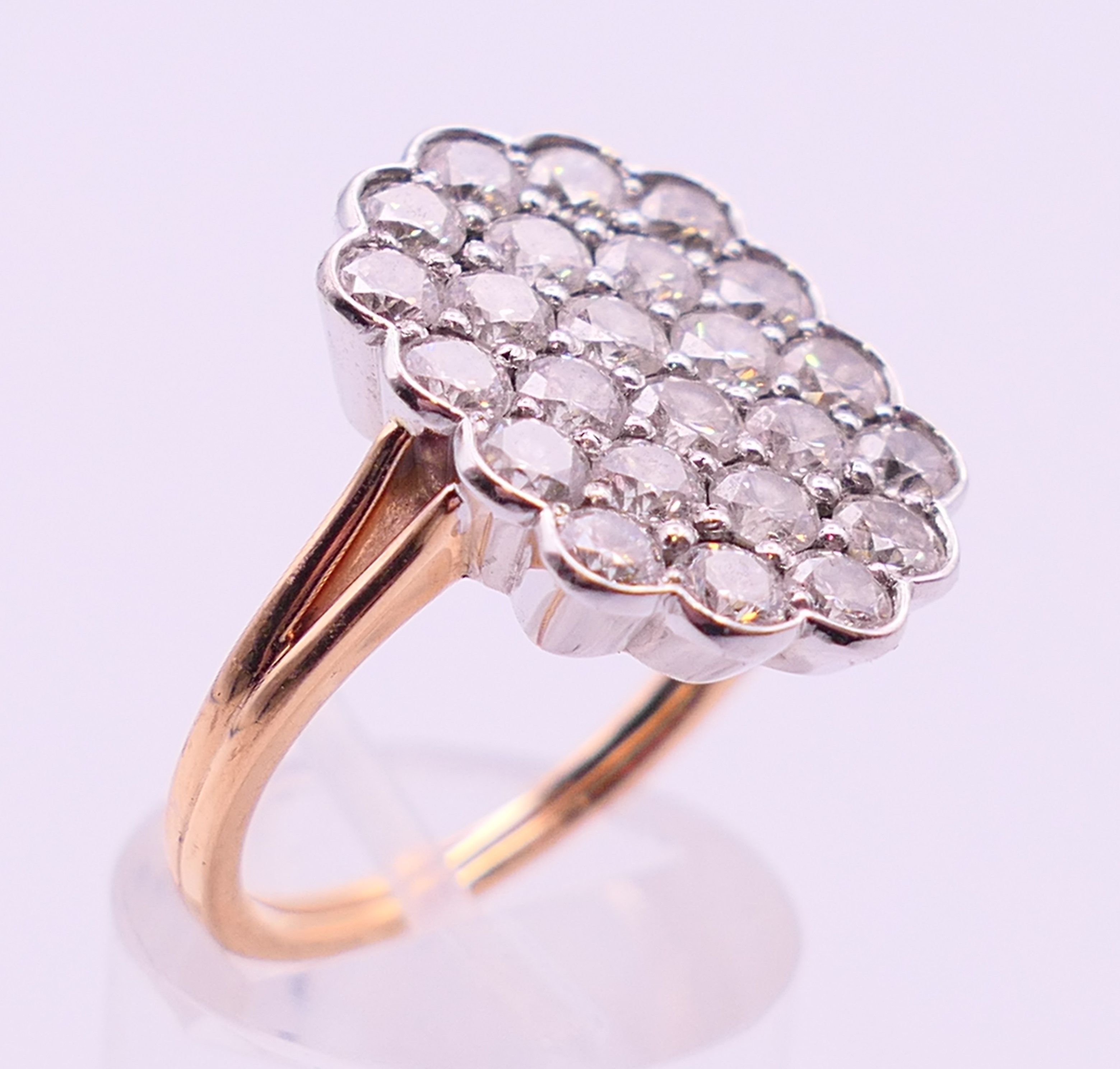 An unmarked gold diamond cluster ring. Ring size Q/R. - Image 3 of 5
