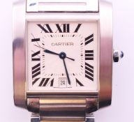 A Cartier Tank Must ladies wristwatch with calendar aperture,