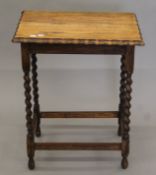 An early 20th century oak barley twist side table. 58 cm wide.