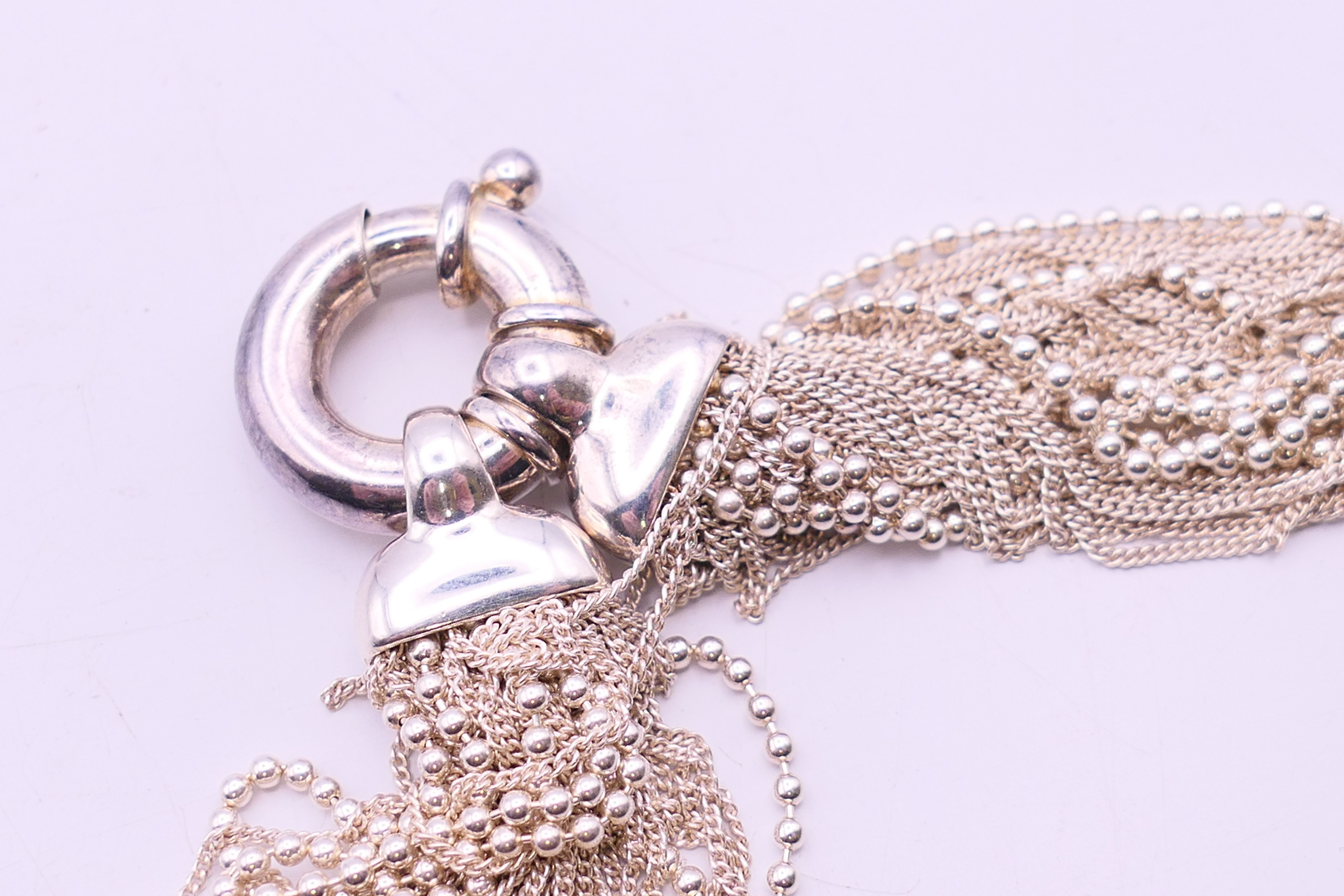 A silver charm bracelet and a silver necklace. The later 34 cm long. - Image 4 of 9