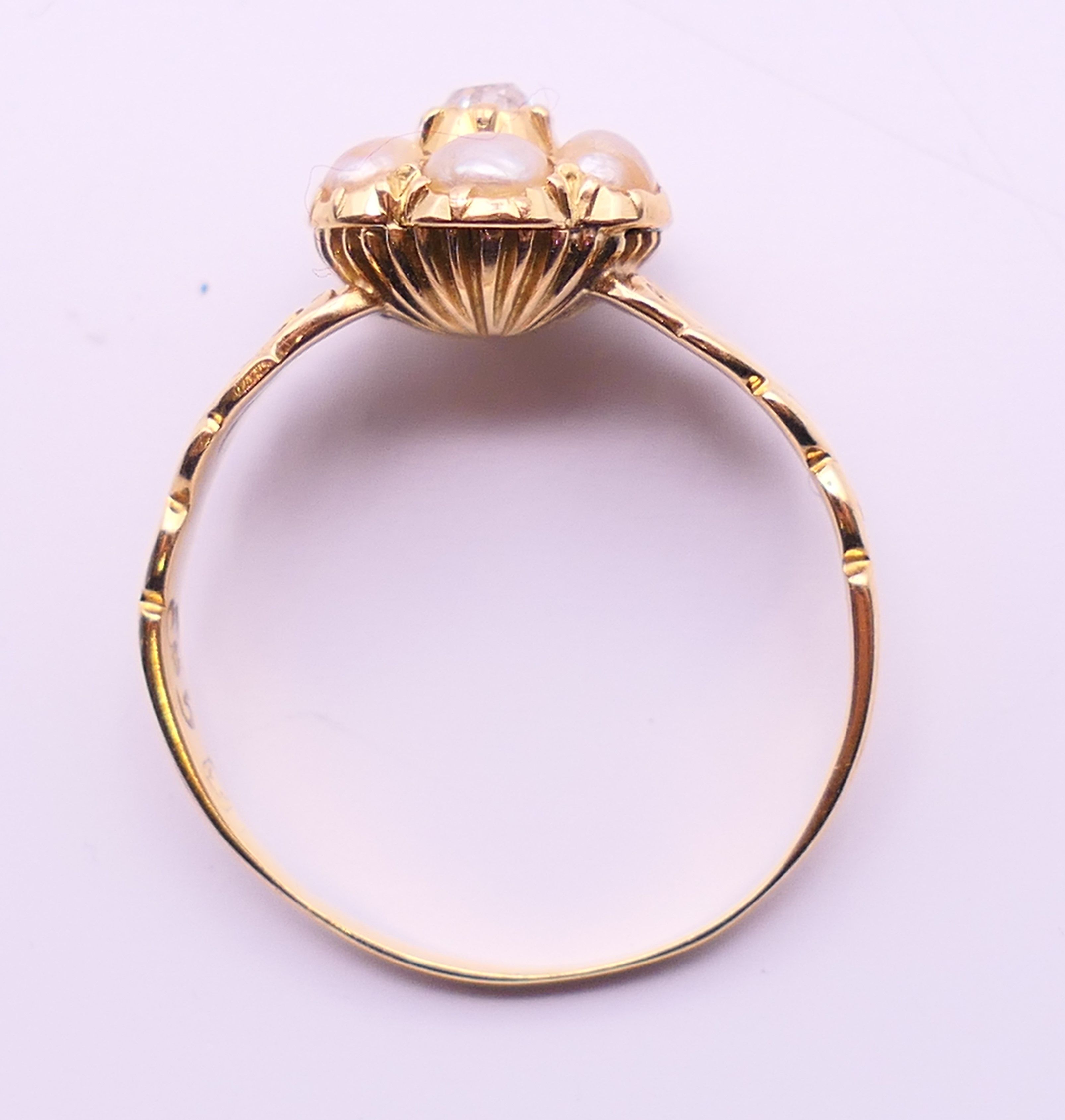 An unmarked gold, diamond and seed pearl ring, and another unmarked gold and seed pearl ring. - Image 11 of 11