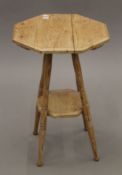 A Victorian pine octagonal side table. 39 cm wide.