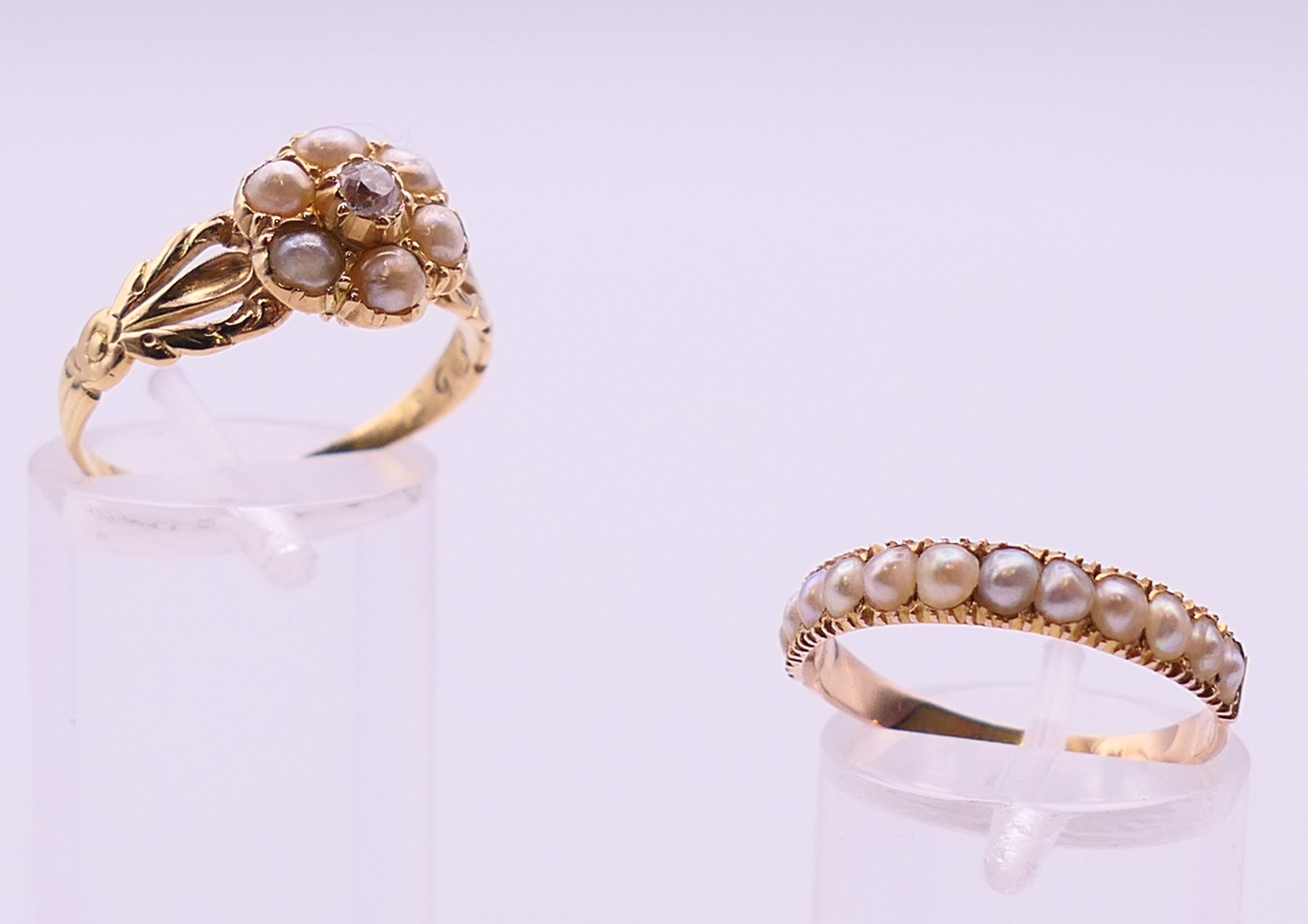 An unmarked gold, diamond and seed pearl ring, and another unmarked gold and seed pearl ring.