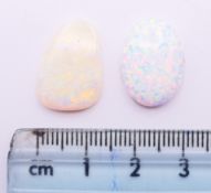 Two loose opals. The larger 2 cm high.