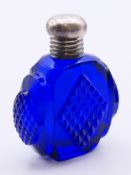 A Victorian Bristol blue glass perfume bottle with a silver top. 5.5 cm high.